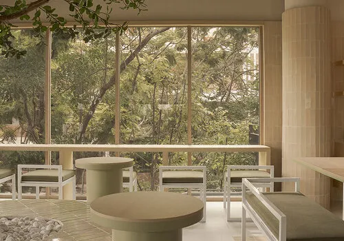 Thai Serenity: A Tranquil Café Where Terracotta, Oak, and Light Converge